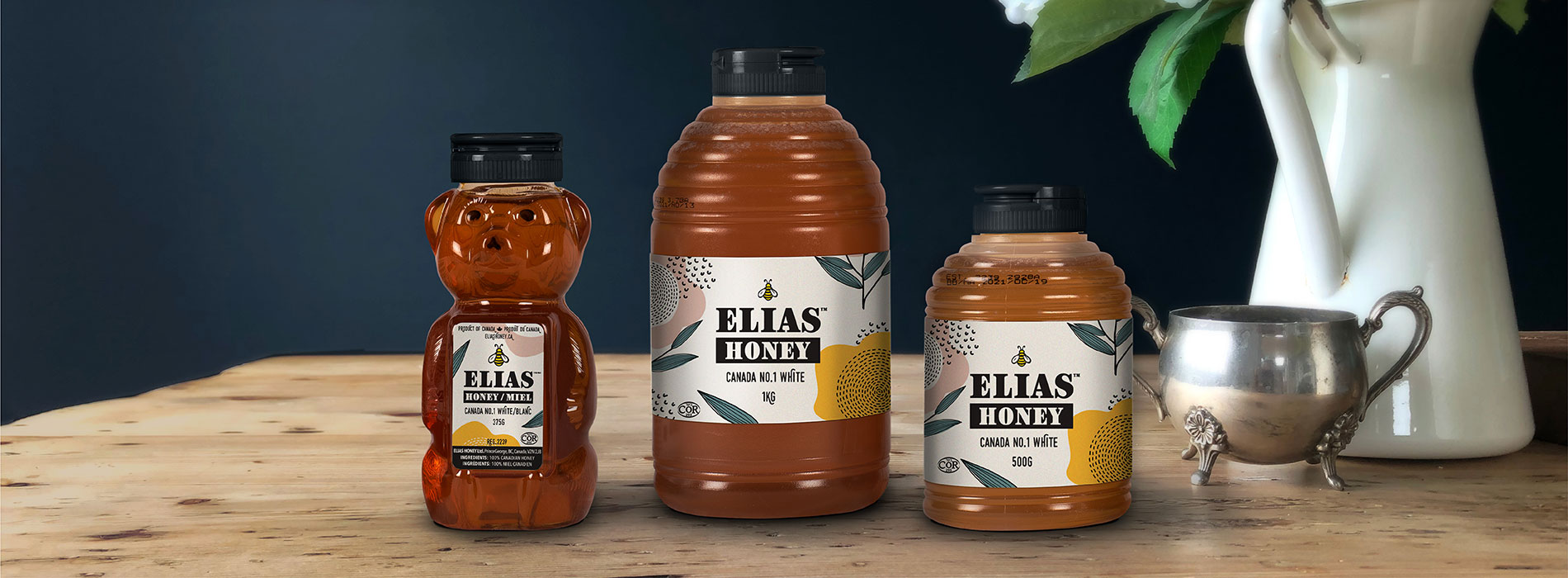 Elias honey squeeze bottles on wood table